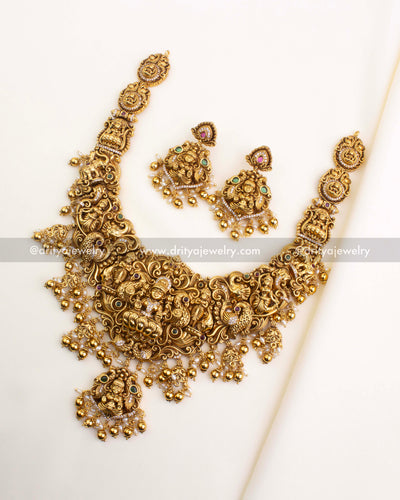 SKU 1167 full temple necklace set with matching earrings laid flat