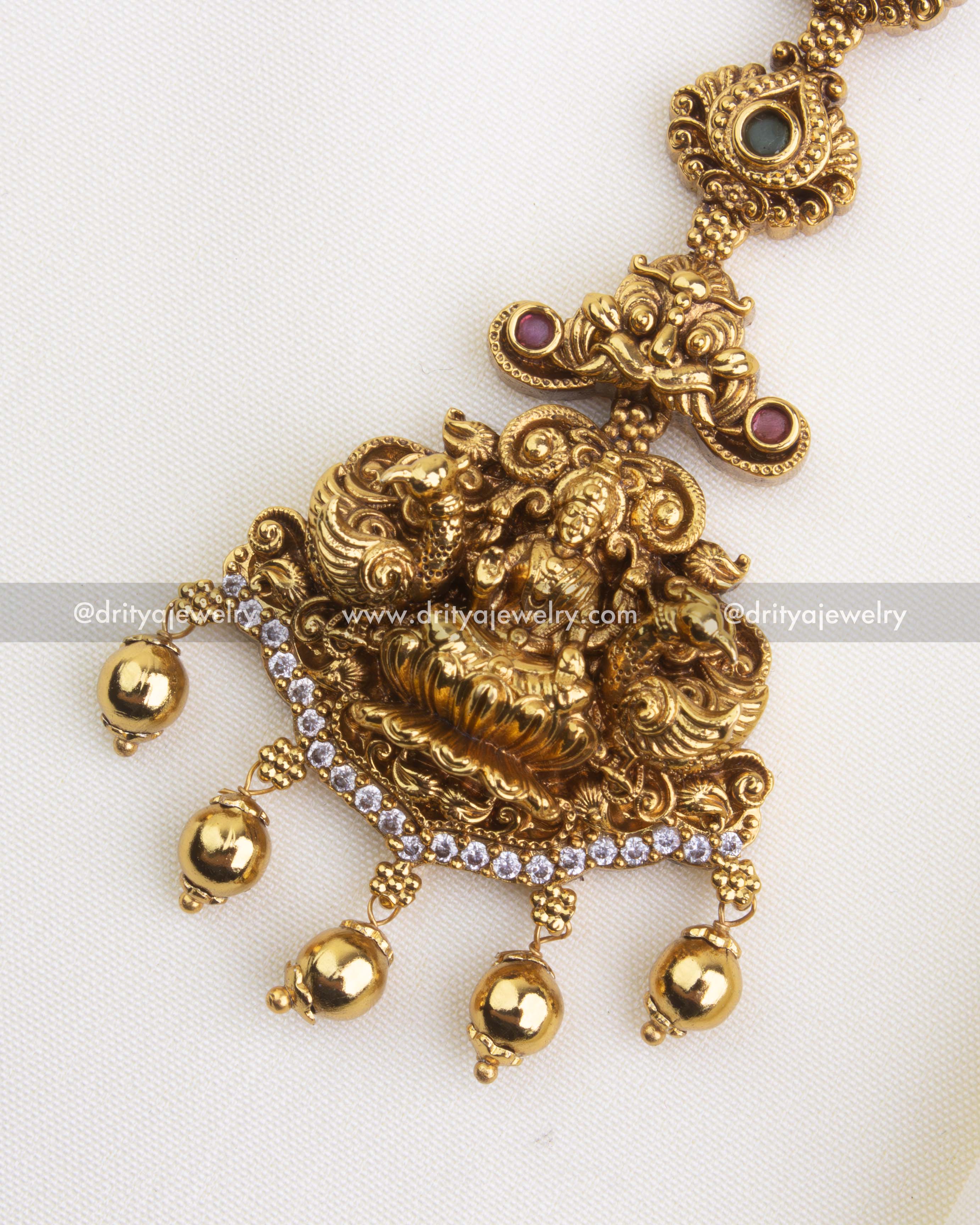 SKU 1148 close-up of antique god idol maang tikka pendant with stone arc and bead drops