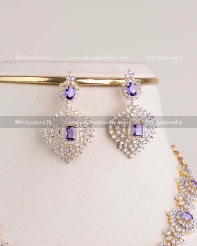 1210-PU earrings close-up showing purple stones and CZ-studded design