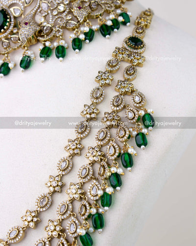 1309-GSET side view of long necklace strands with floral and teardrop motifs