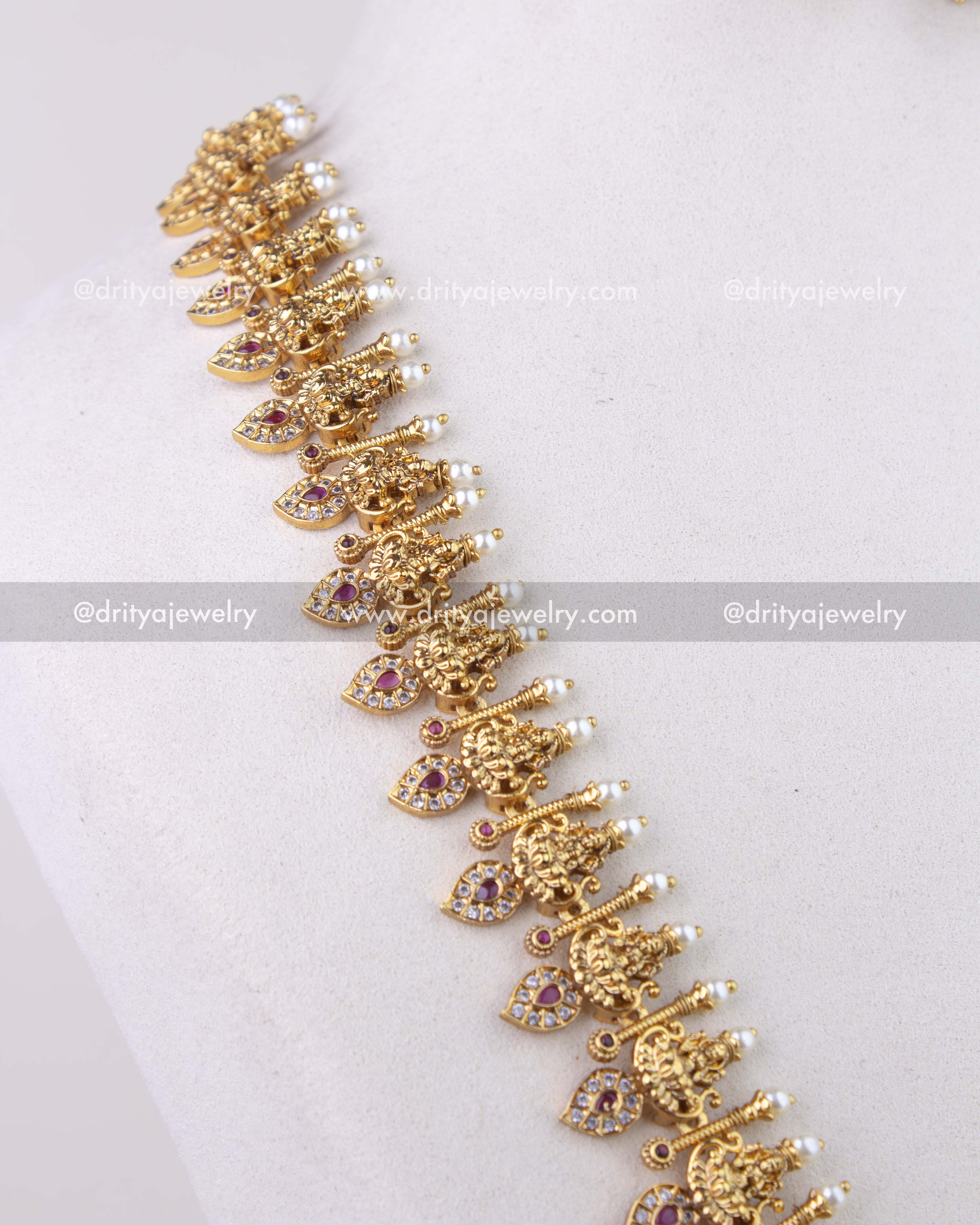 1279-R god idol mango motif necklace angled close view