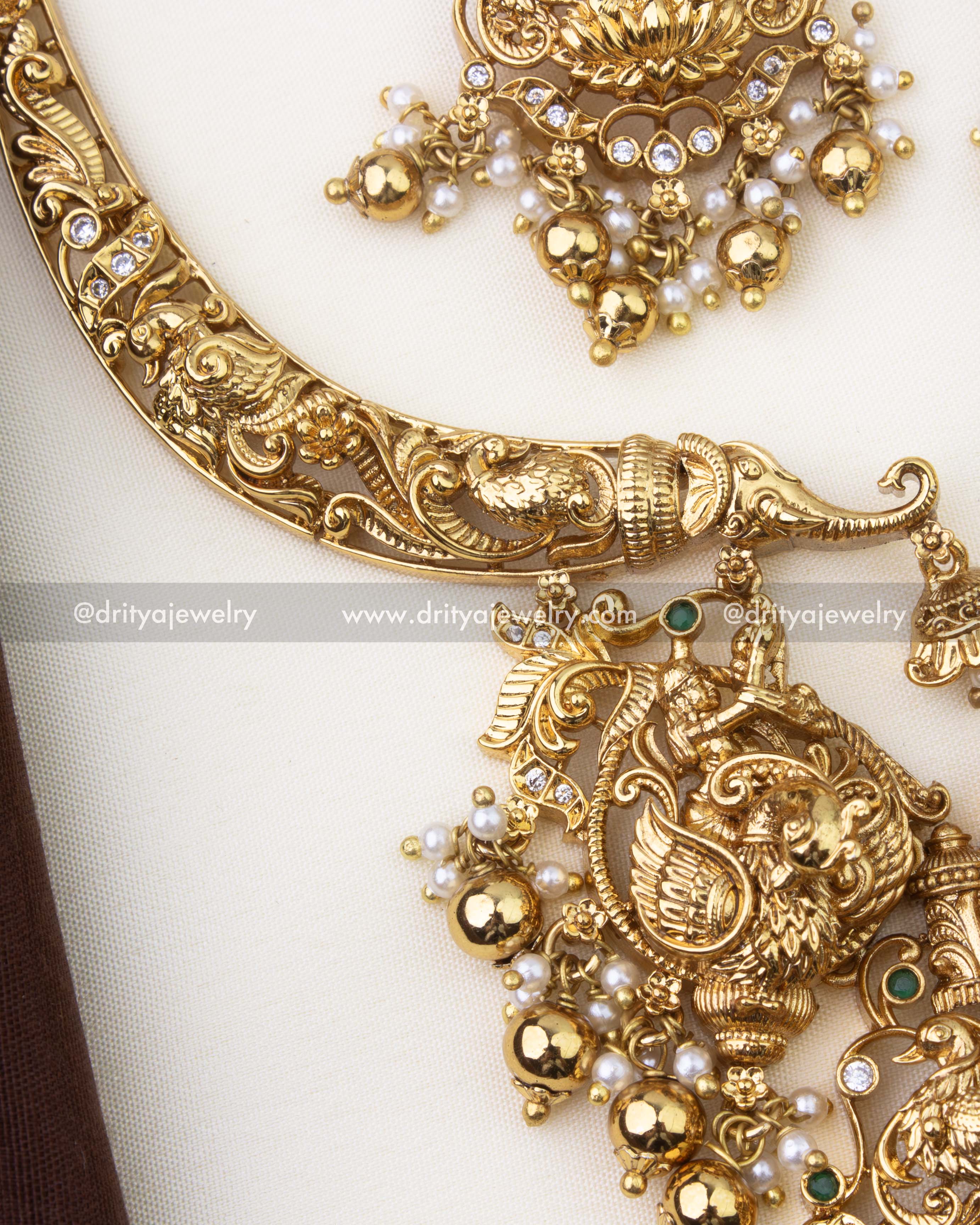 1263-GO close-up of kanti-style necklace side band with intricate nakshi work and stones