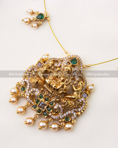 1216-G close-up of Lakshmi temple pendant with emerald stones and pearl danglers