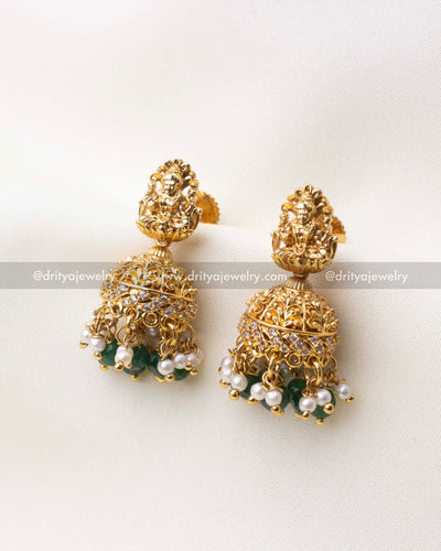 1101-G Lakshmi temple jhumka earrings with green beads and pearl-like drops front view