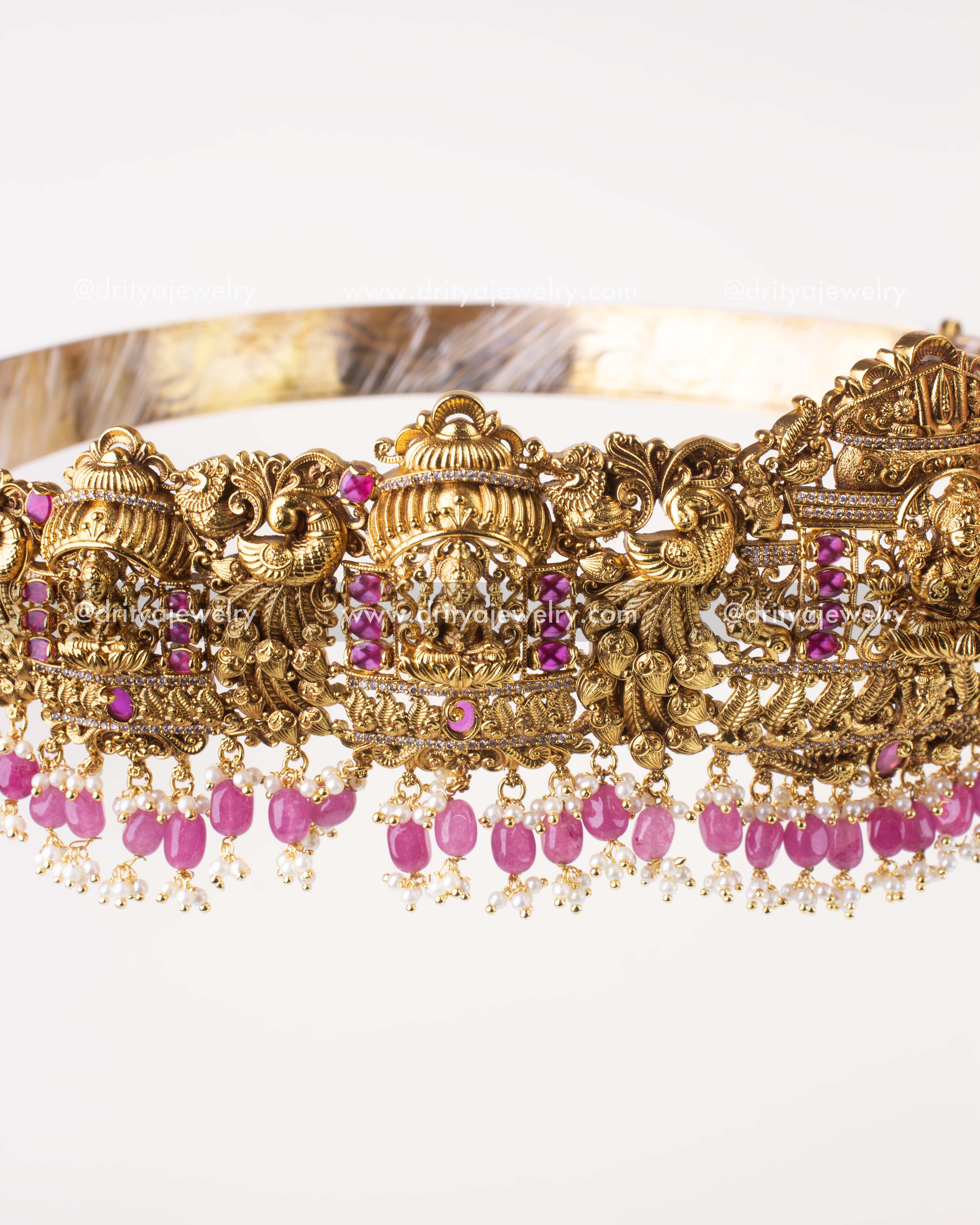 1207-WB side angle showing peacock motifs and ruby pink drops on waist belt