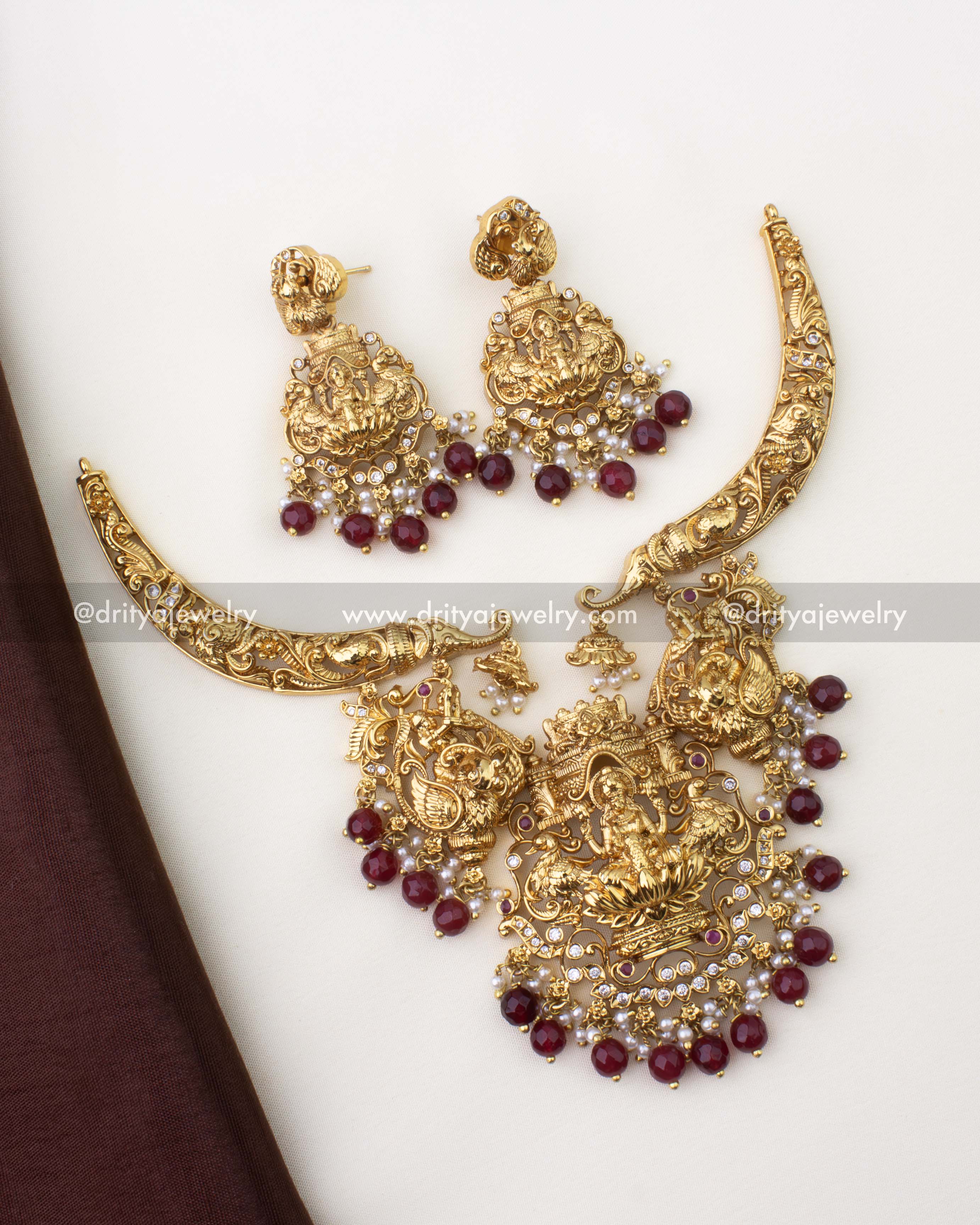 1263-R premium nakshi god idol necklace set with matching earrings laid flat