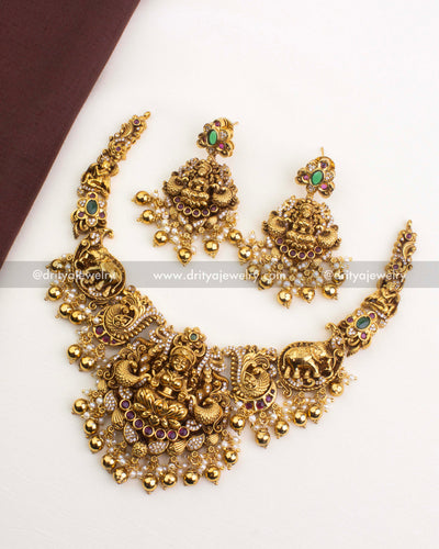 SKU 1250 full temple necklace set with matching earrings laid flat