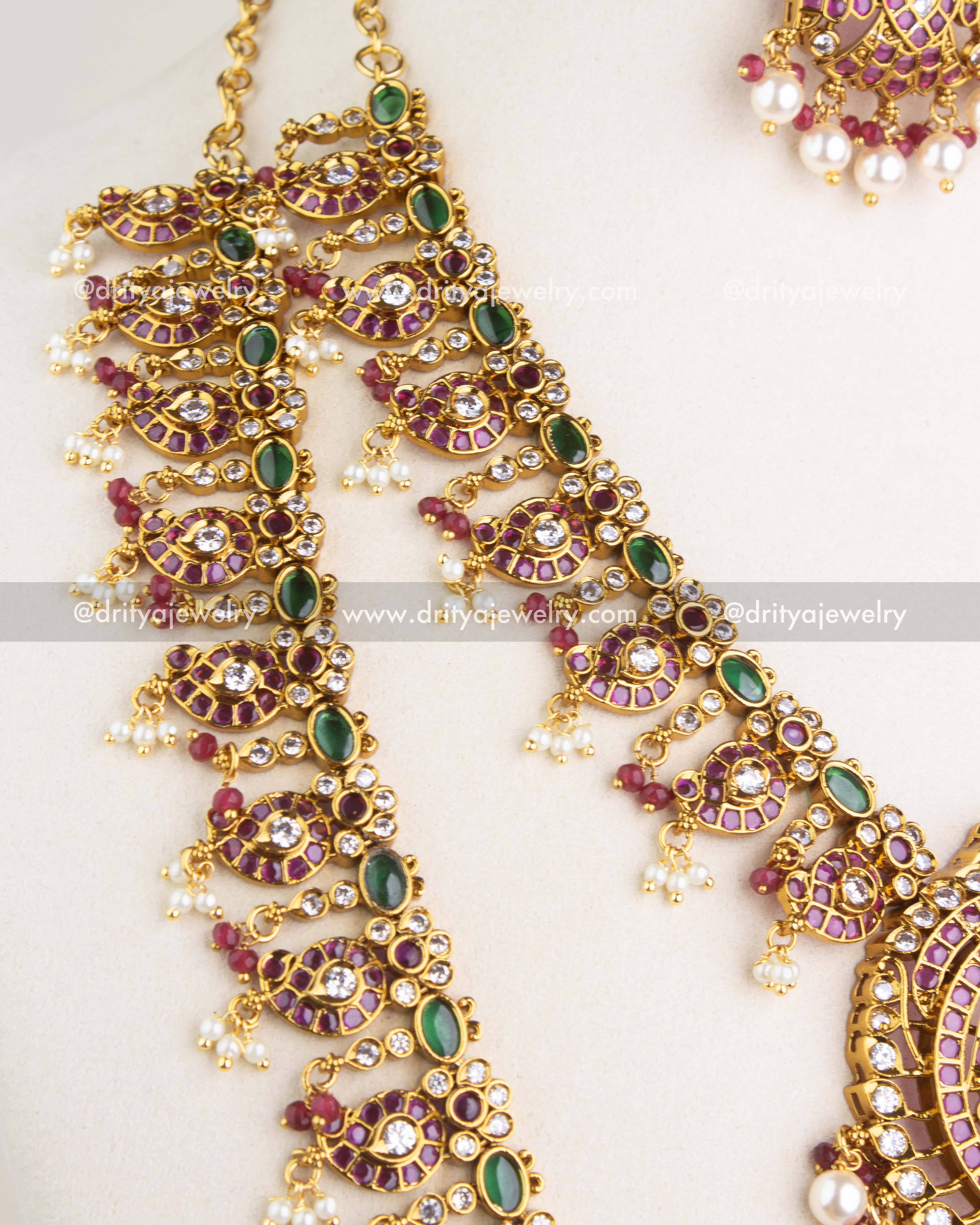 1201 - Necklace Set - Side view of long necklace links with paisley stone motifs