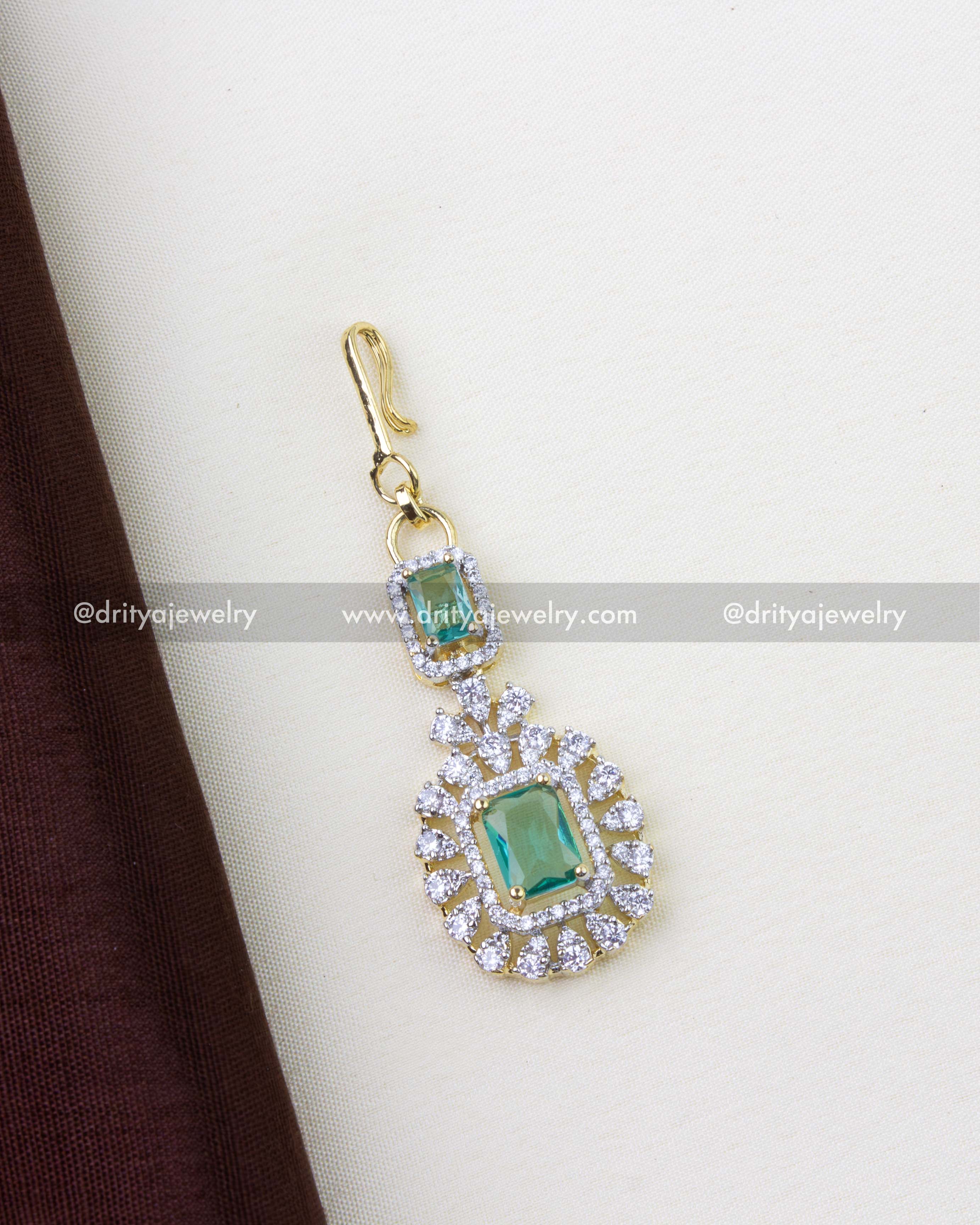 Premium emerald and CZ stone maang tikka with dual-tone GJ polish, SKU 1258-RE