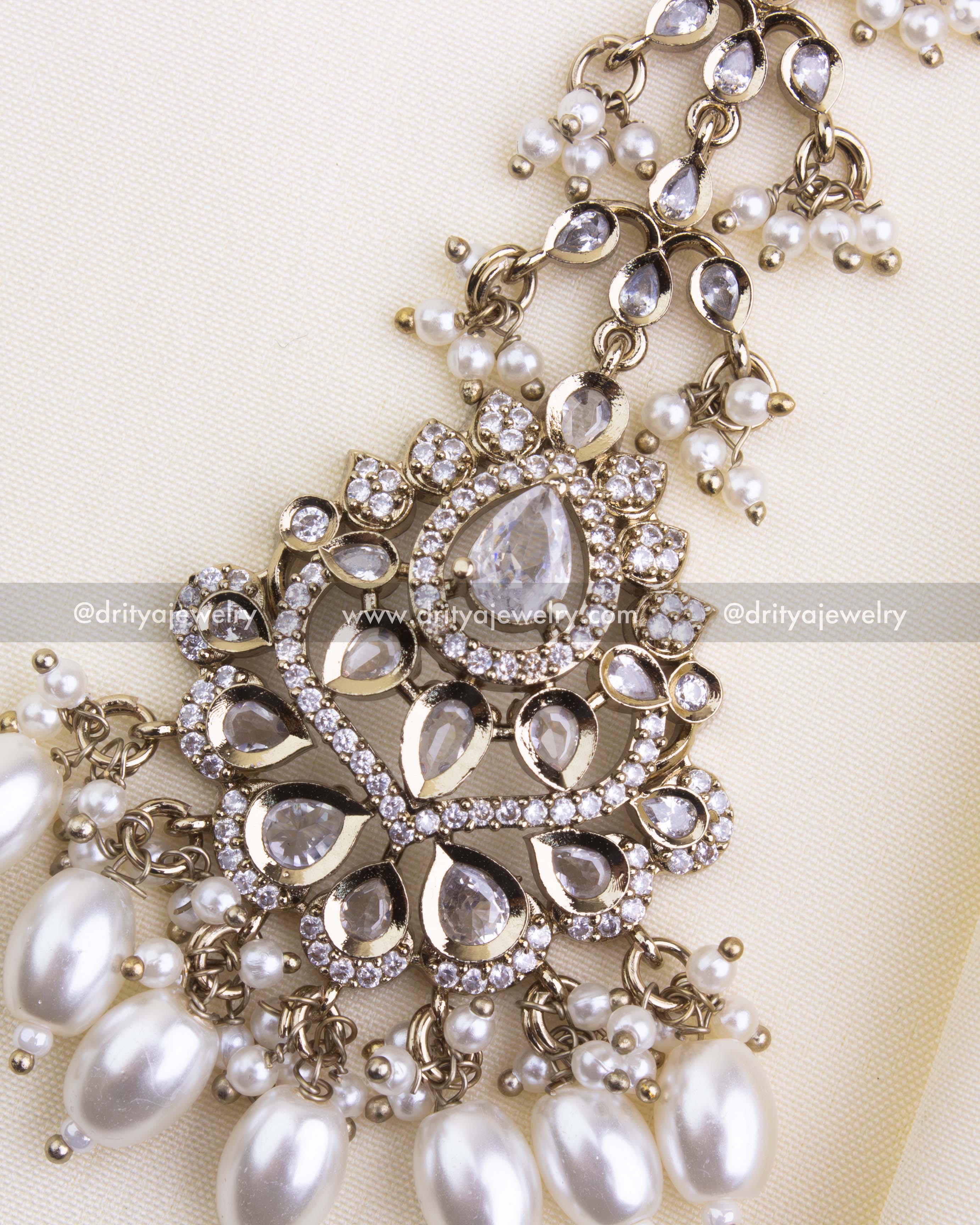 Close-up of bridal maang tikka with diamond-like stones and pearl hangings, SKU 1133-W