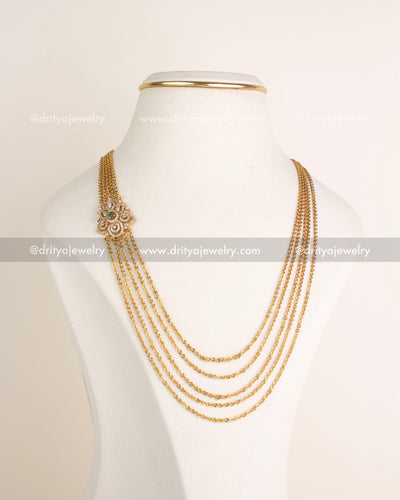 Full view of multi-layered gold-tone CZ chandrahaar necklace on display bust, SKU 1120-G