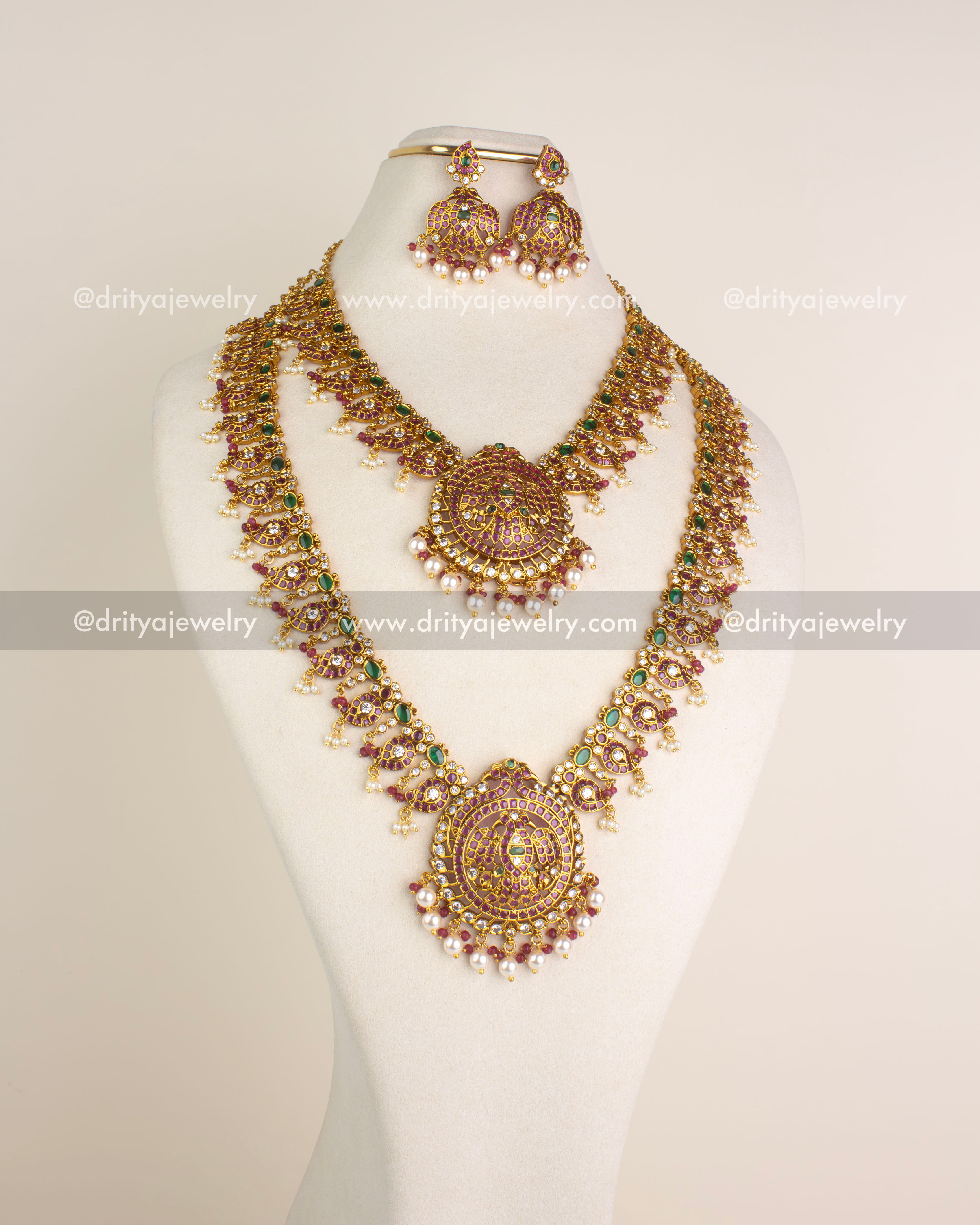 1201 - Necklace Set - Full display of long and short idol motif necklaces with earrings