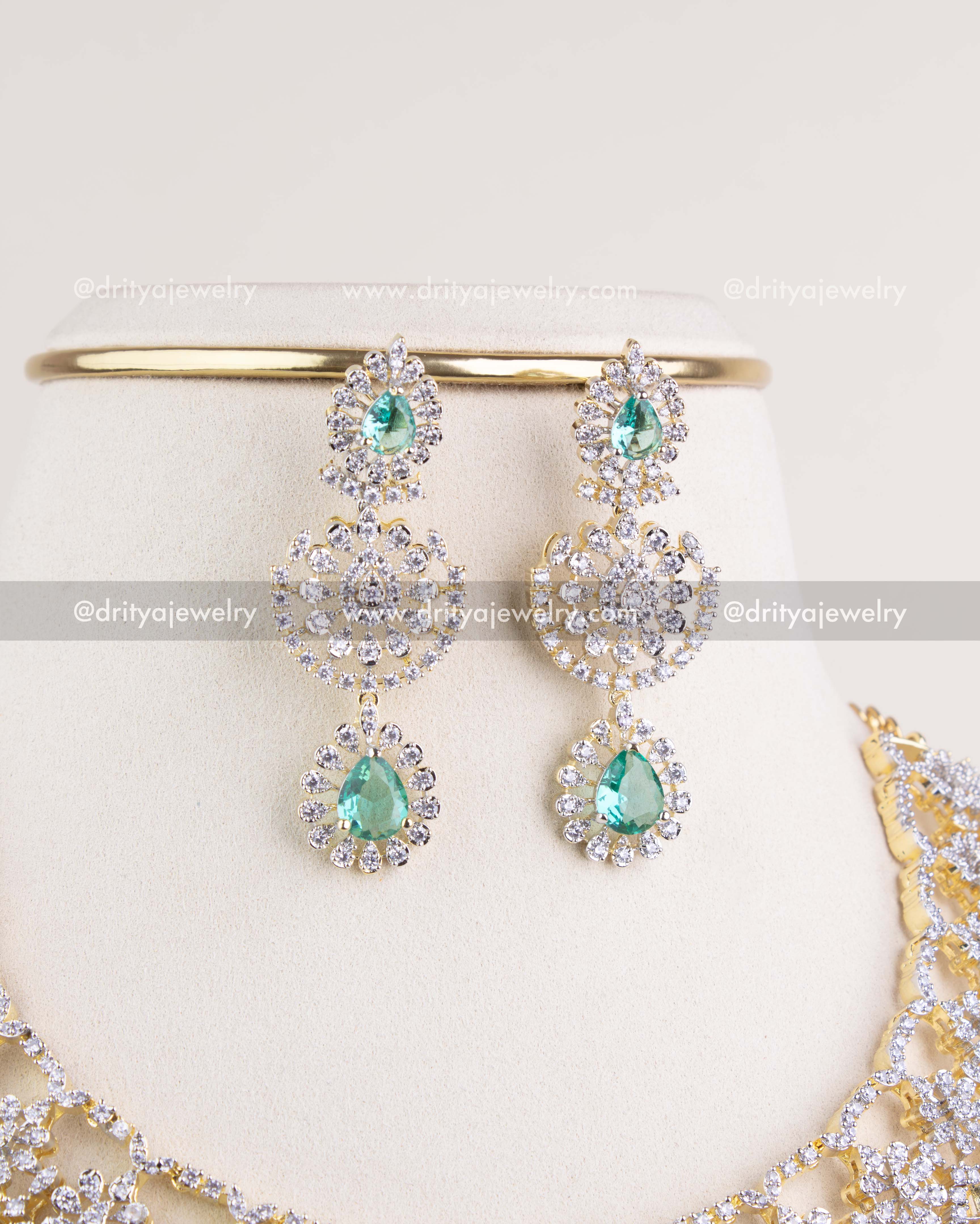 1209-RE matching long emerald and CZ dangler earrings front view