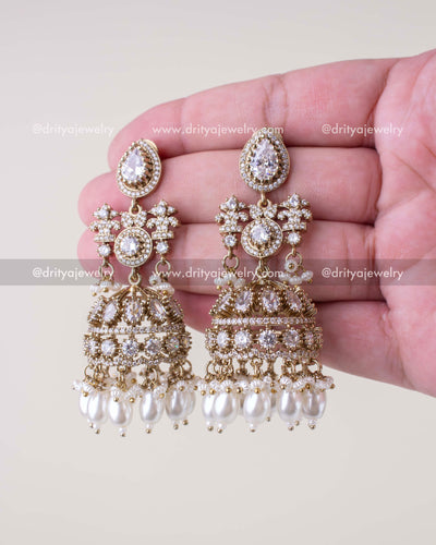 1257-W pair of premium Victorian bridal jhumka earrings front view in hand