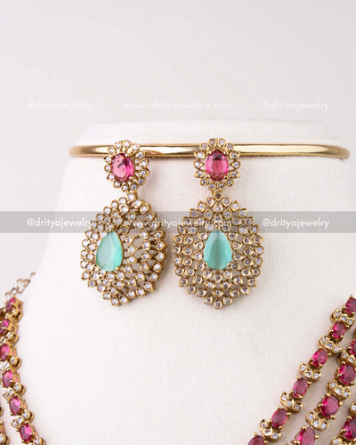 1296-R close-up of matching ruby and mint drop earrings with stone halo