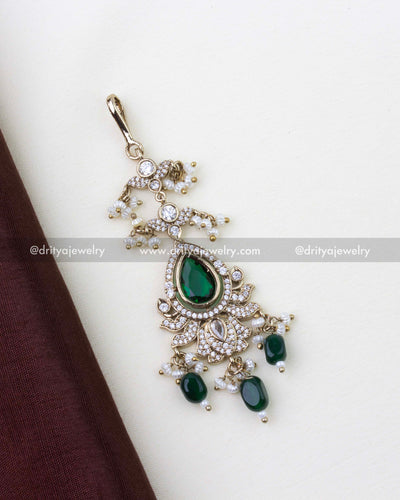 1275-G close-up of emerald and stone-studded maang tikka with bead drops