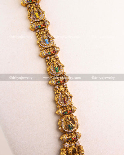 Side view of deity-studded long necklace chain in gold-plated temple style