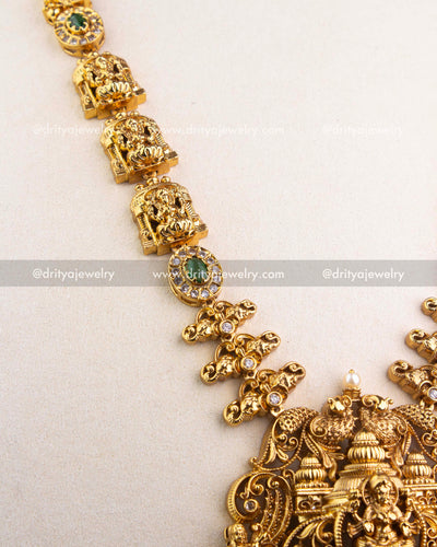 1240-G detailed view of deity motif links and green stone accents along the long necklace chain