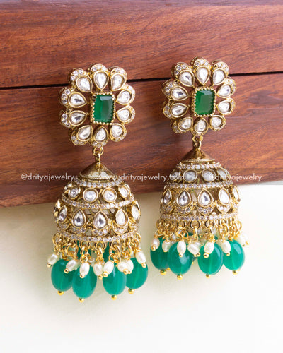 1157 Necklace Set close-up of kundan jhumka earrings with emerald green and pearl-like drops