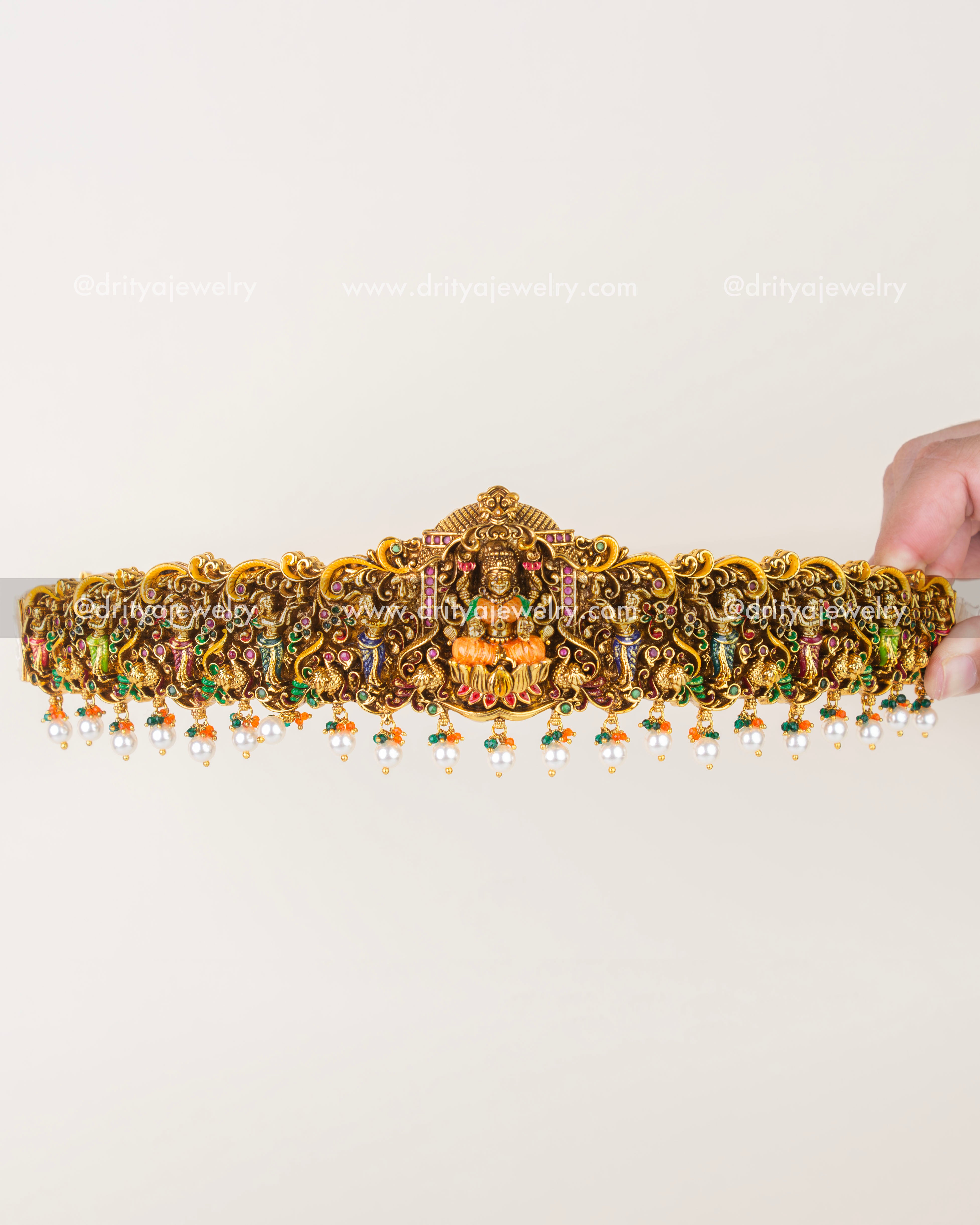 Full view of ornate temple-style waist belt with dangling pearl clusters