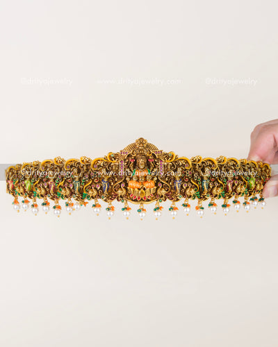 Full view of ornate temple-style waist belt with dangling pearl clusters