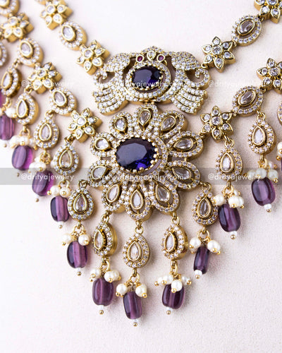 1309-PUL Central figurine-style motif and floral detailing of necklace