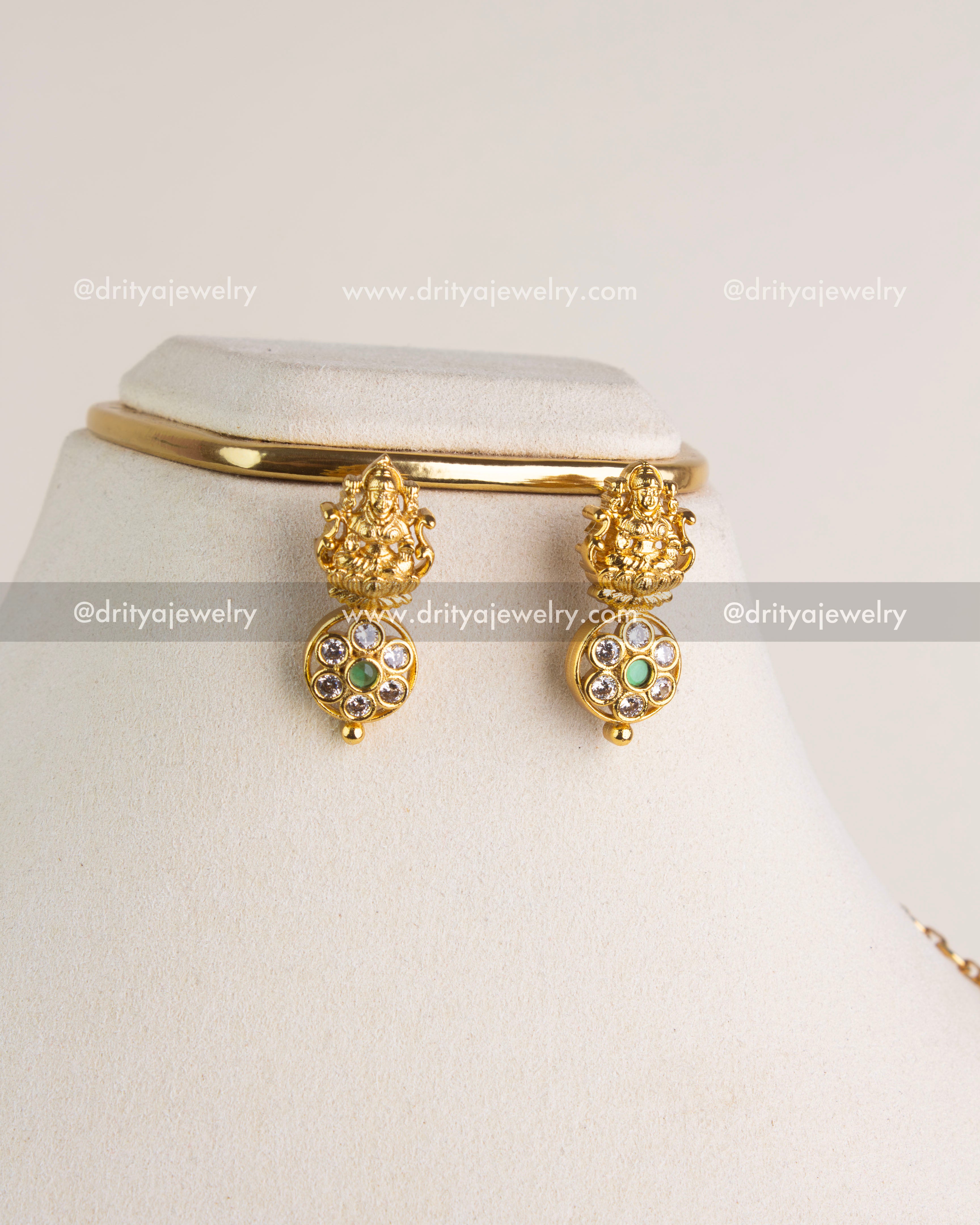 SKU 1145 Necklace Set close-up of god idol drop earrings with CZ and green stones