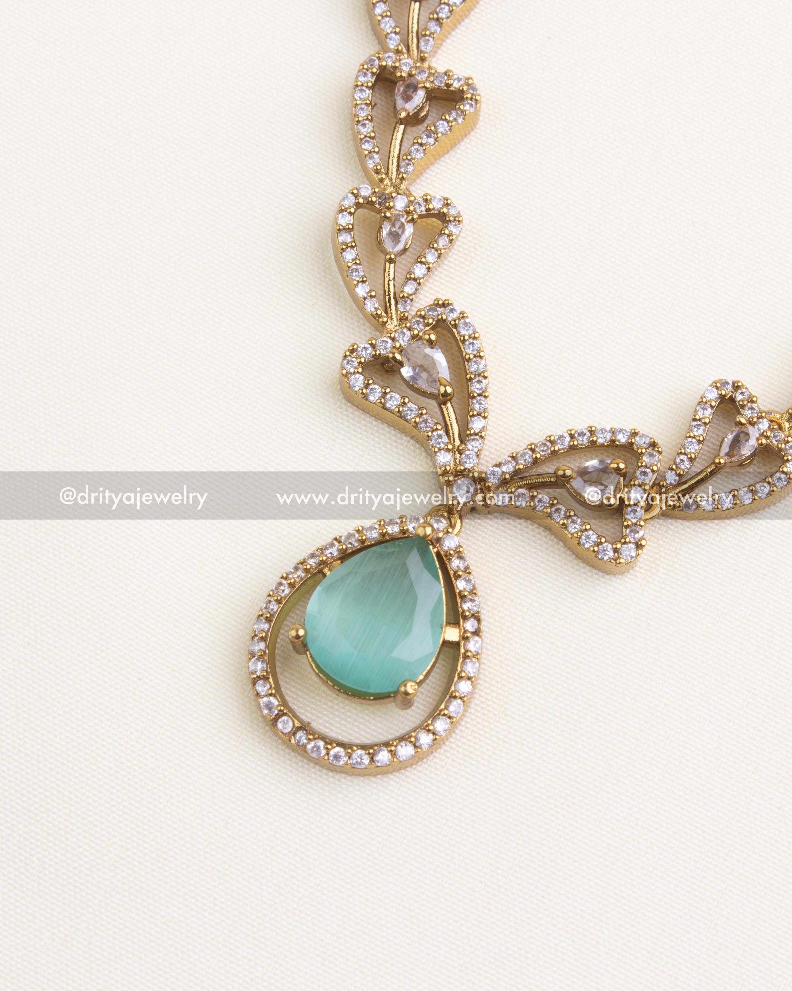 1152-MG Necklace Set - detailed side view of pendant with blush pink pear stone and stone-studded frame