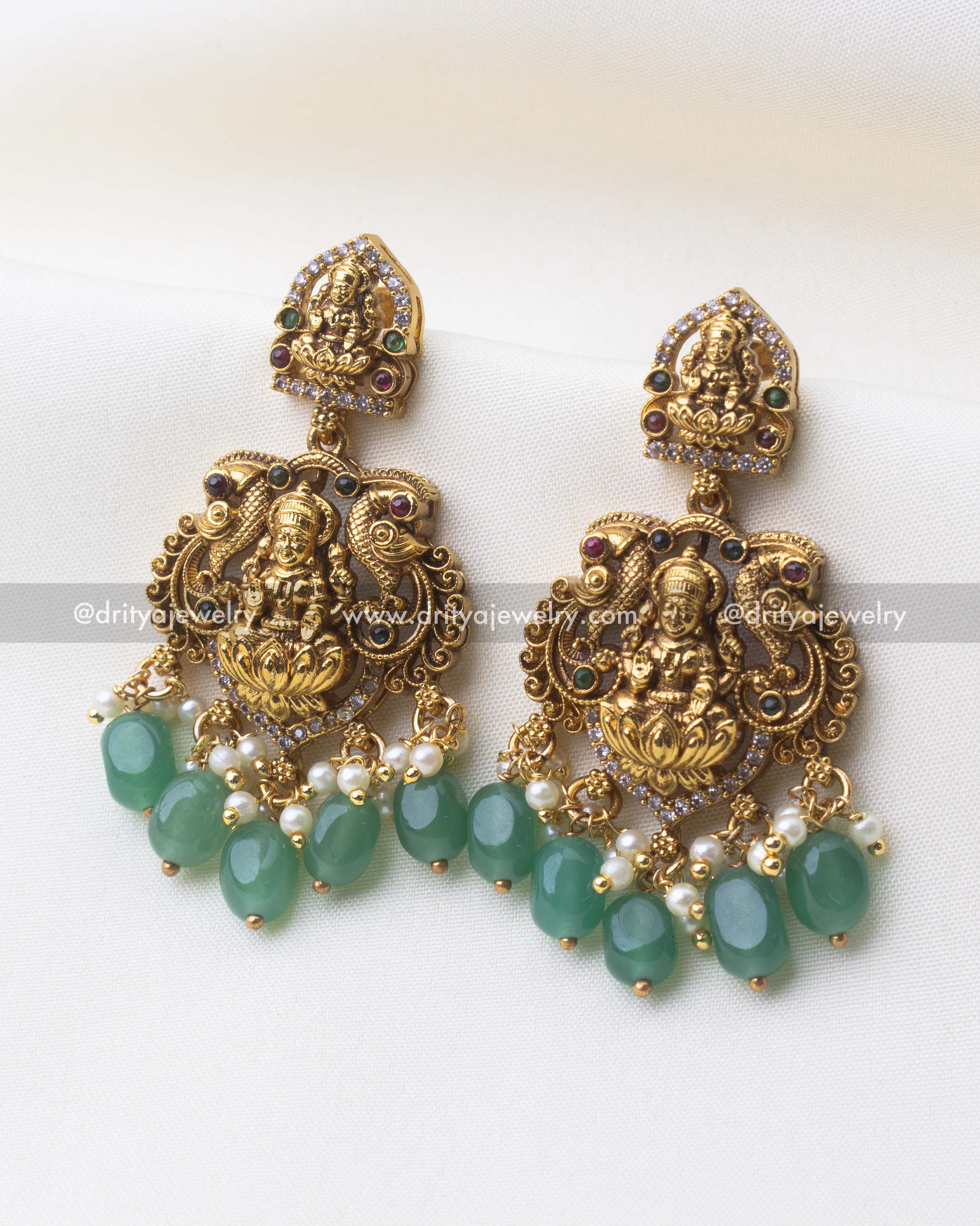 1249-G temple god idol earrings with green bead and pearl drops close-up