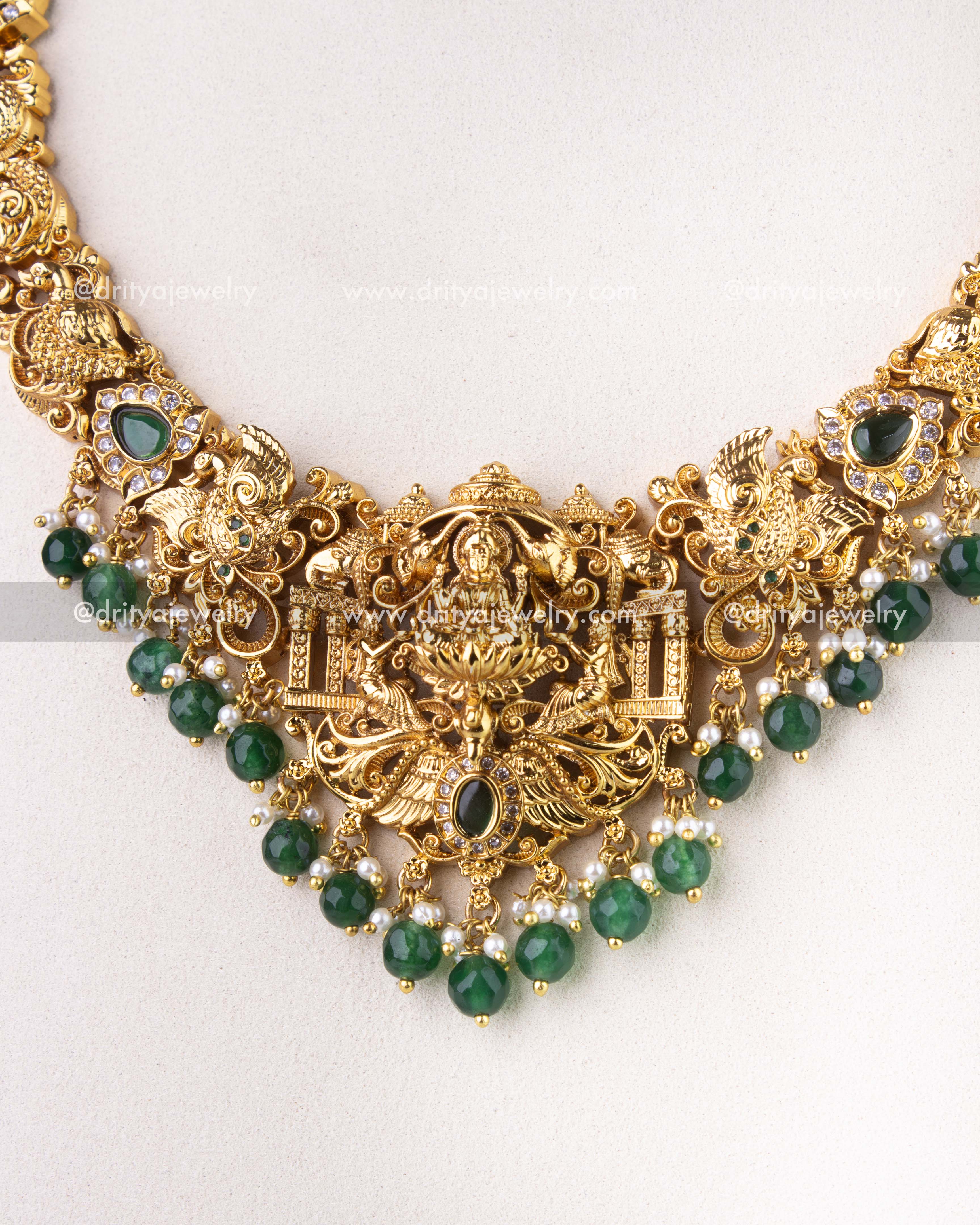 1270-G front close-up of ornate temple pendant with layered green beads