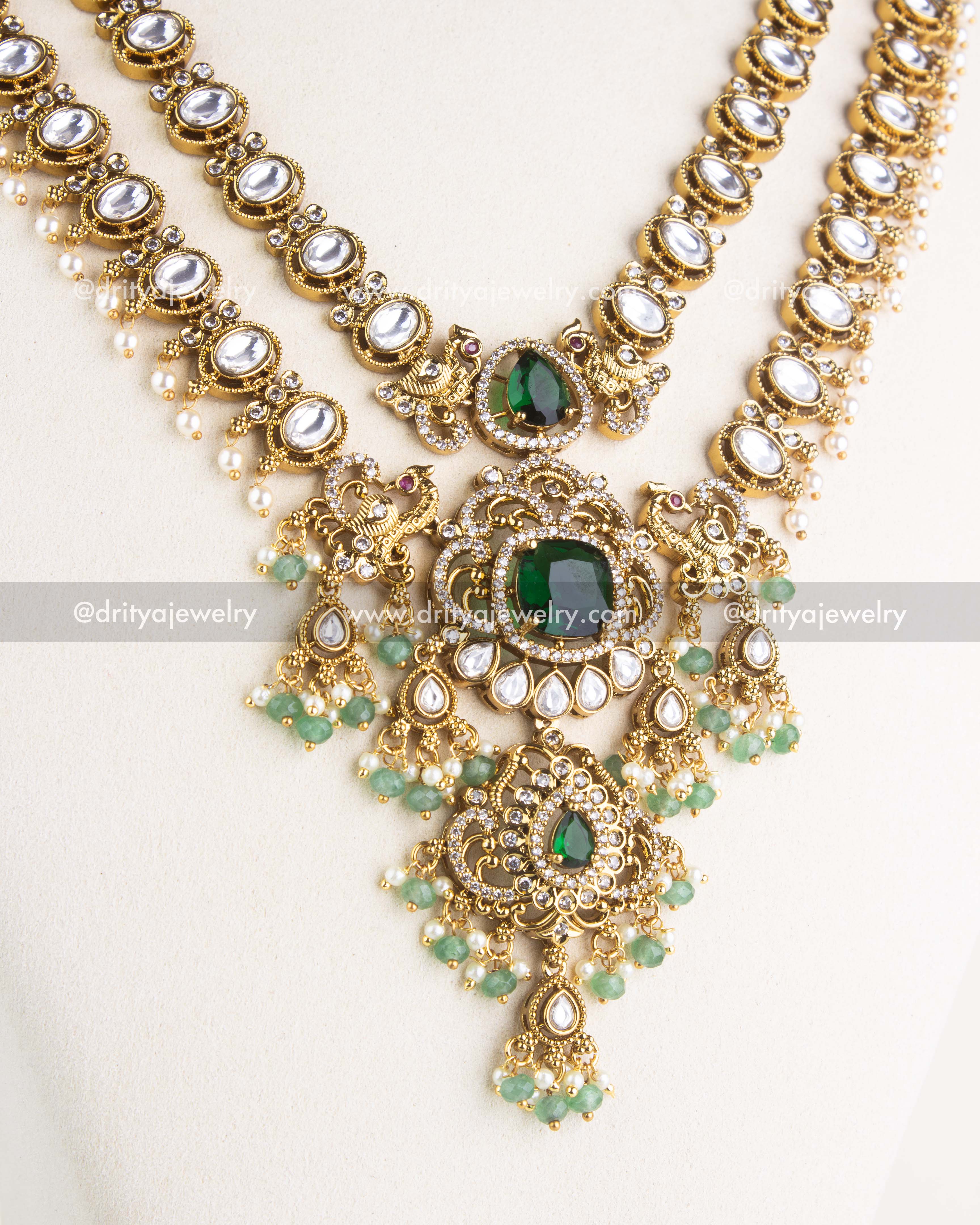 Detailed view of idol-inspired pendant with green stones and bead drops on layered necklace, SKU 1156-G - Necklace Set - Close View