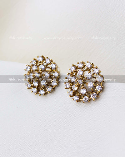 SKU 1304 - Close-up of round floral CZ stud earrings in light gold finish