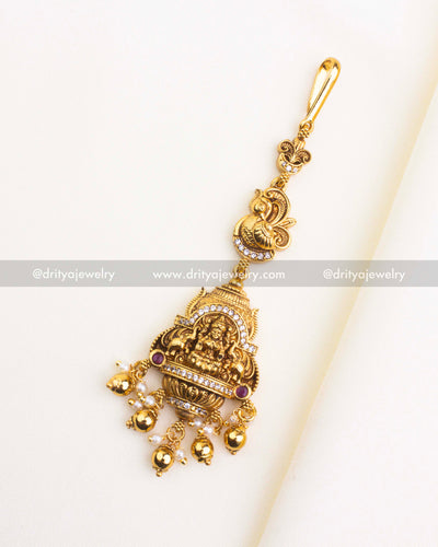 1154-GO full view of gold-toned temple god idol maang tikka with hook and hanging drops