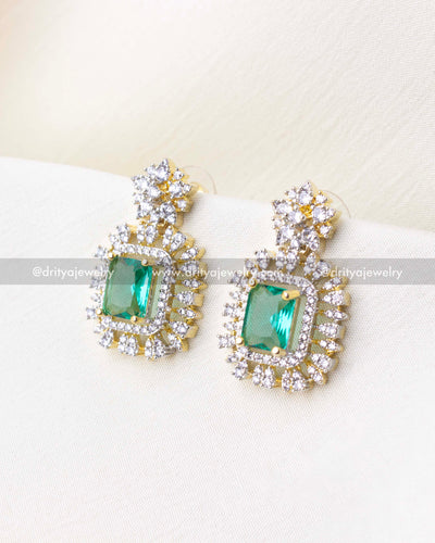 1276-RE emerald centre stone earrings close-up front view