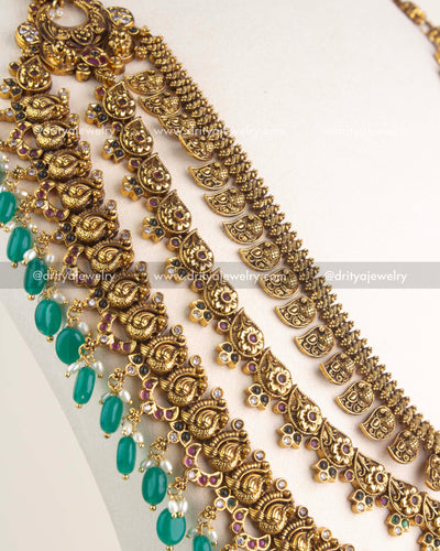 SKU 1164 Necklace Set side angle showing cascading layers and green bead drops along the necklace edge.