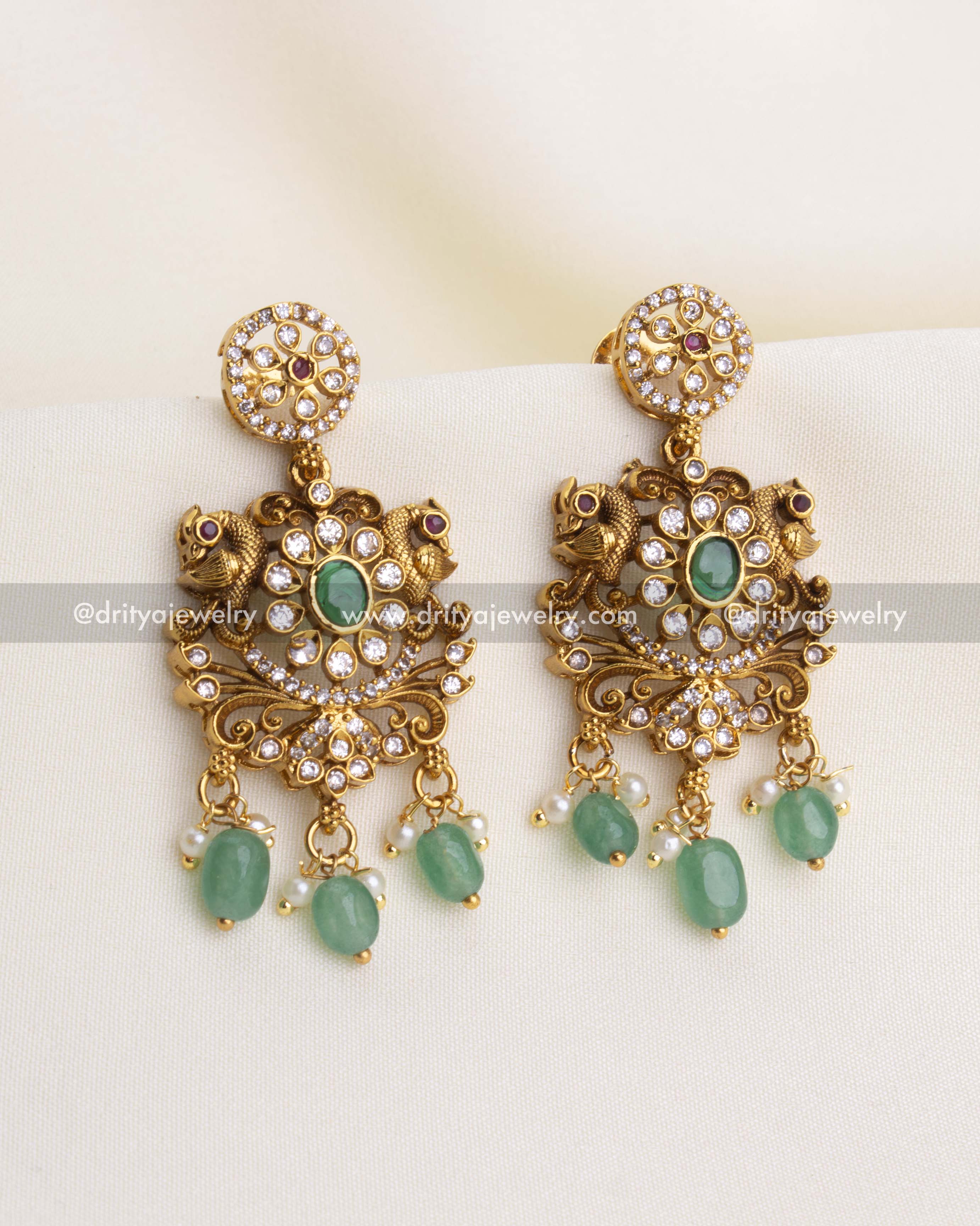 SKU 1192 antique gold idol motif dangler earrings front view