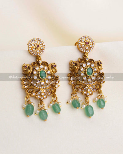 SKU 1192 antique gold idol motif dangler earrings front view