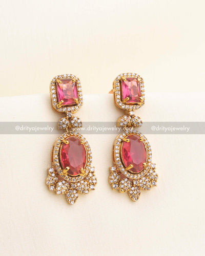Ruby-red CZ earrings with halo settings.