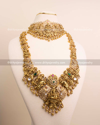 Full Premium Nakshi Temple Set with Kundan work including choker, long necklace, earrings, and maang tikka displayed on mannequin