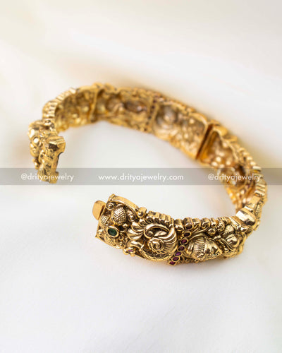 Antique gold bridal temple bangles with Lakshmi motif and Nakshi detailing